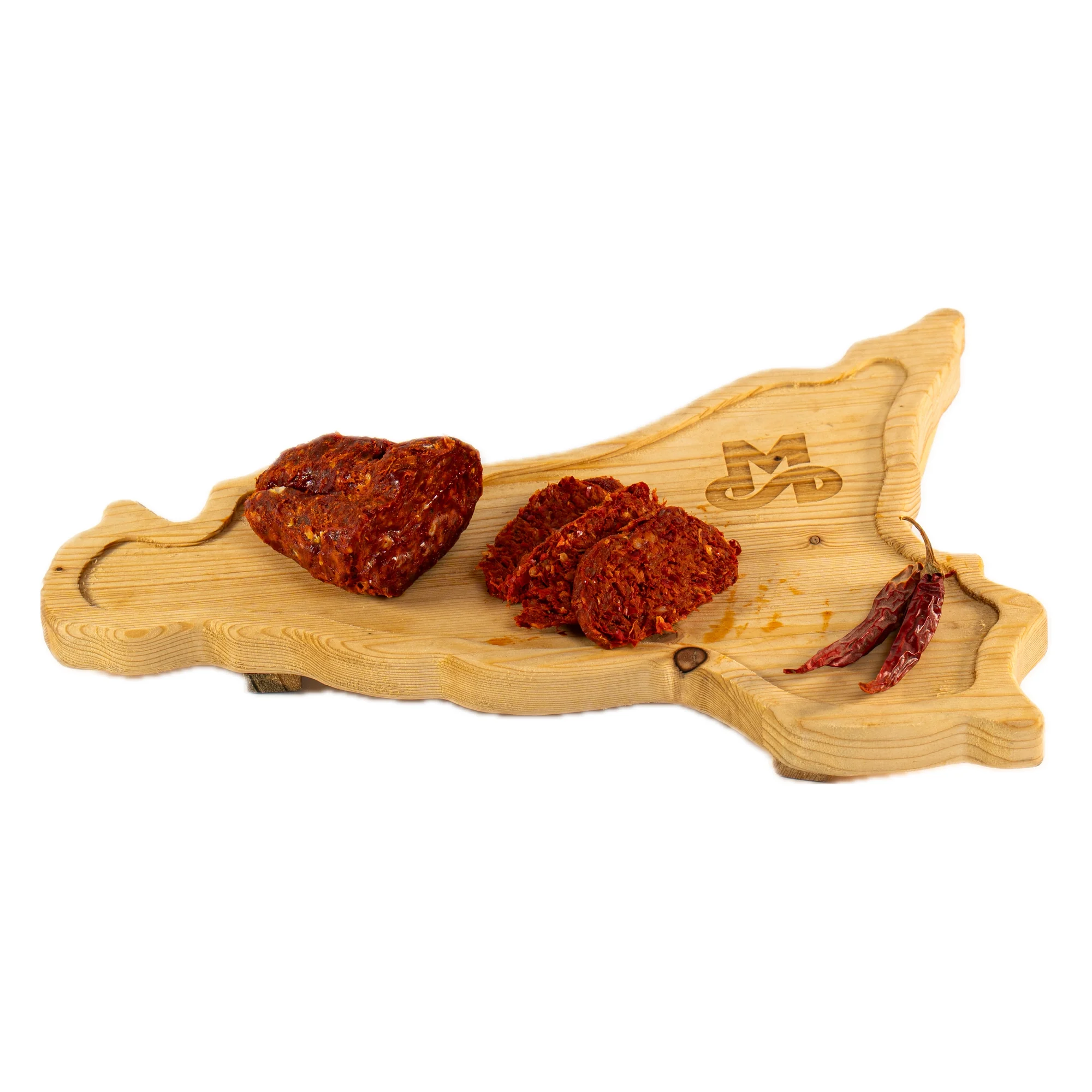 ’nduja di suino nero dei nebrodi: ’Nduja con Suino Nero MonteSoprano a fette con peperoncini secchi su tagliere di legno